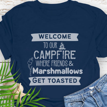 Navy Blue Funny “Welcome to Our Campfire Where Friends & Marshmallows Get Toasted” t-shirt with bold text design for campers and party lovers.