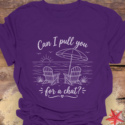 Purple t-shirt with a beach graphic and text "Can I pull you for a chat?".
