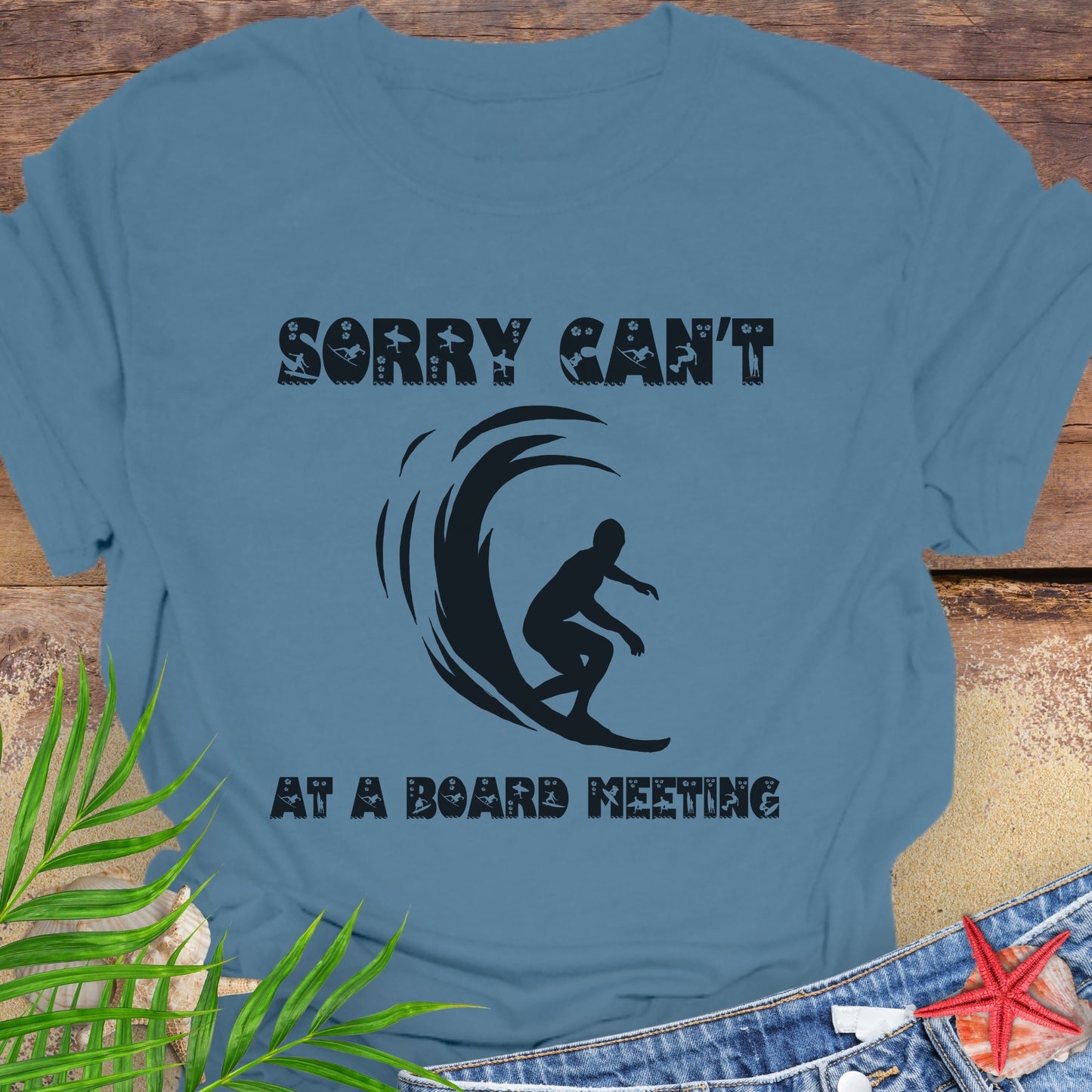 Indigo Blue t-shirt with a surfer and says Sorry Can't Board Meeting.