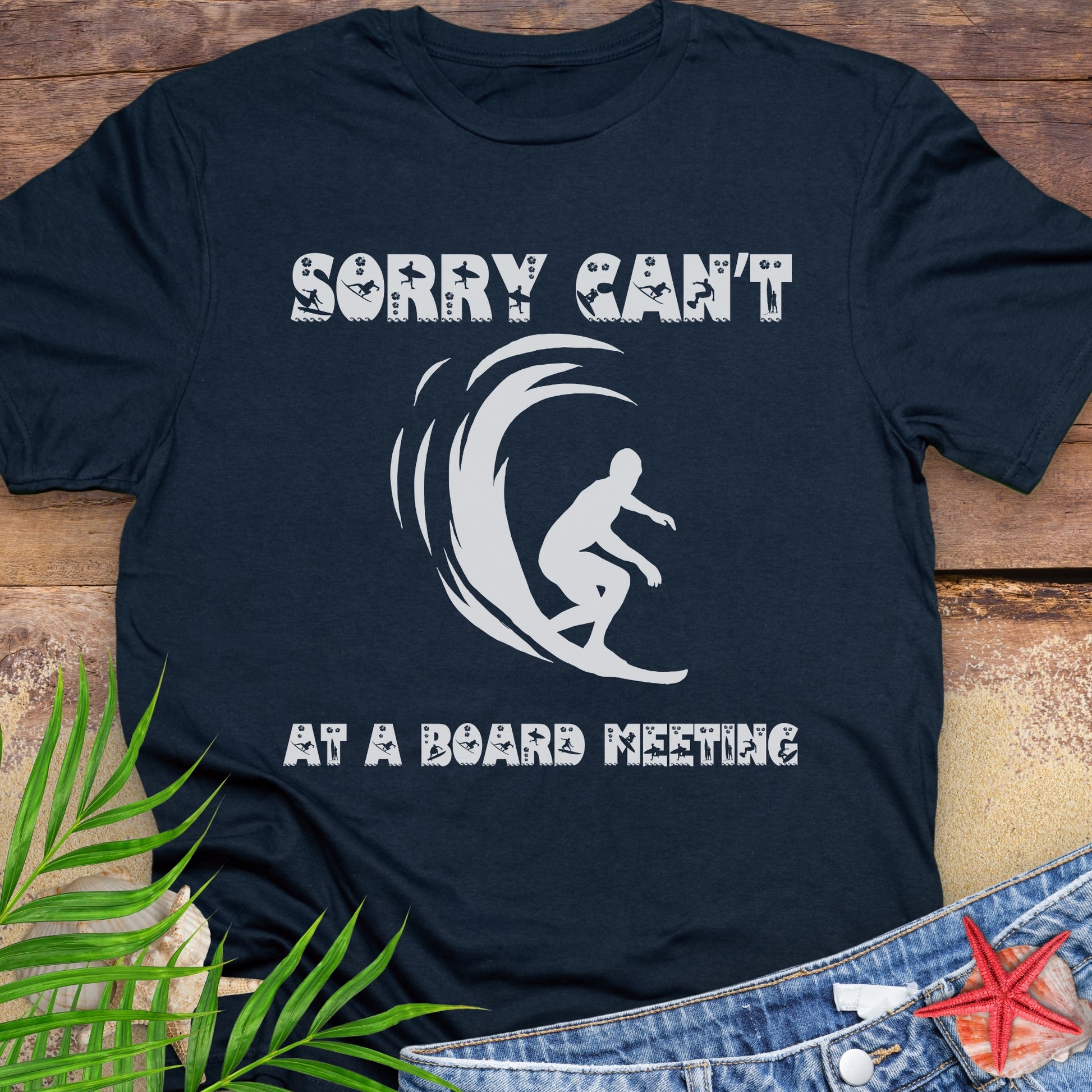 Navy Blue t-shirt with a surfer and says Sorry Can't Board Meeting.