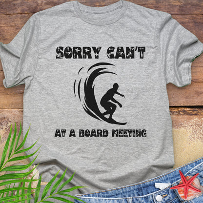 Gray t-shirt with a surfer and says Sorry Can't Board Meeting.