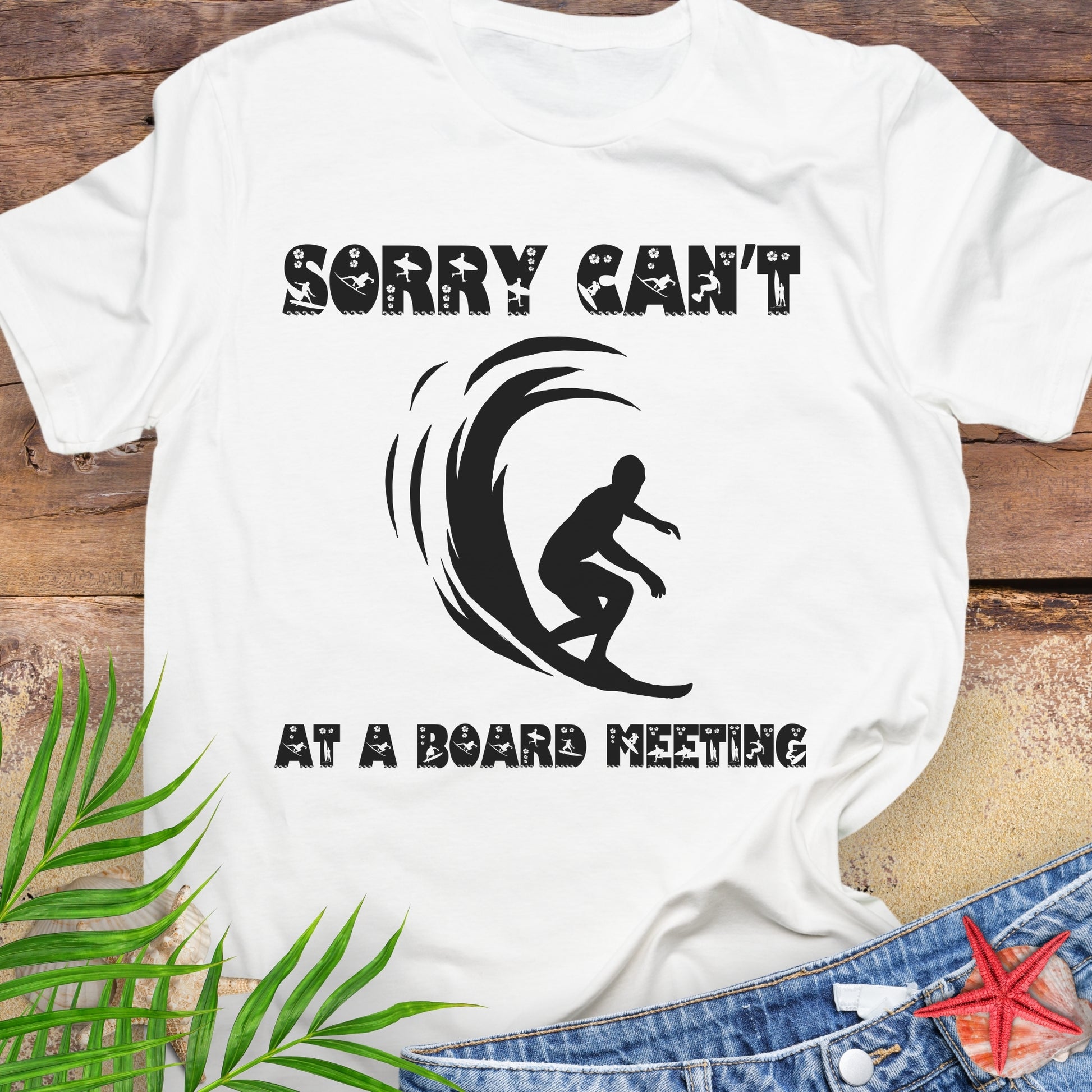 White t-shirt with a surfer and says Sorry Can't Board Meeting.