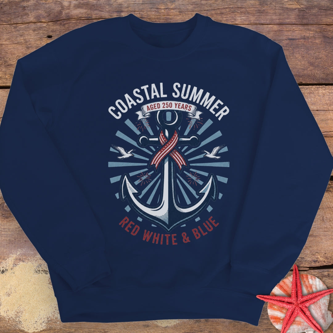 Navy blue sweatshirt with anchor design and 'Coastal Summer' text on a wooden surface.