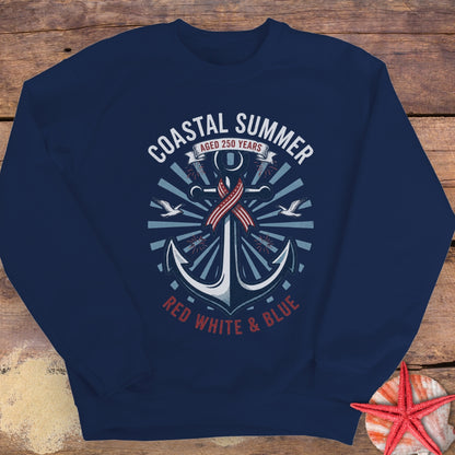 Navy blue sweatshirt with anchor design and 'Coastal Summer' text on a wooden surface.