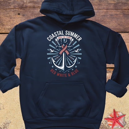 Navy blue hoodie with an anchor design and text on a wooden surface.