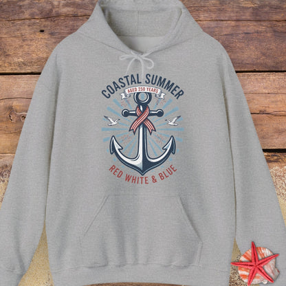 Gray hoodie with an anchor design on a wooden surface