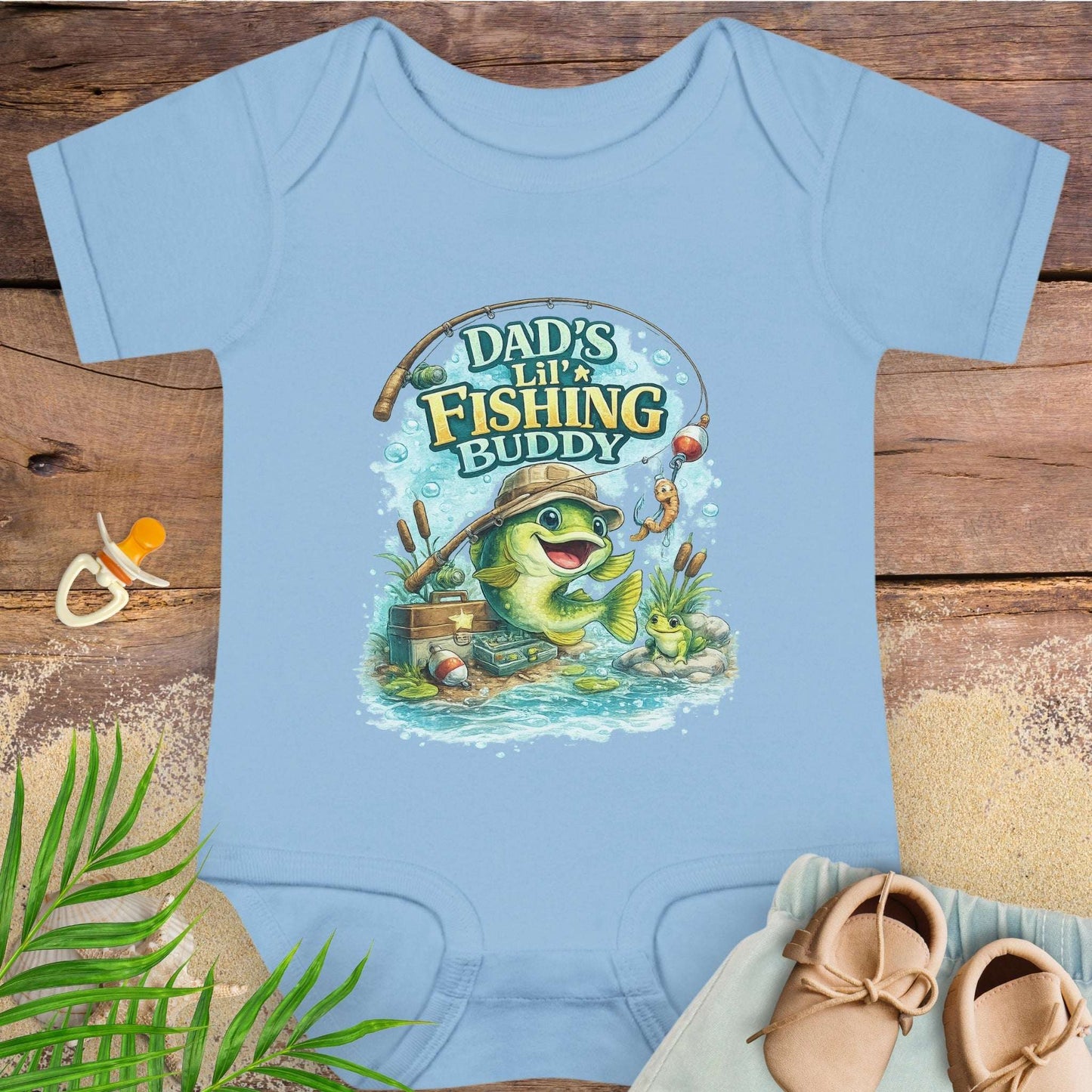 Baby blue baby onesie with 'Dad's Lil' Fishing Buddy' design.