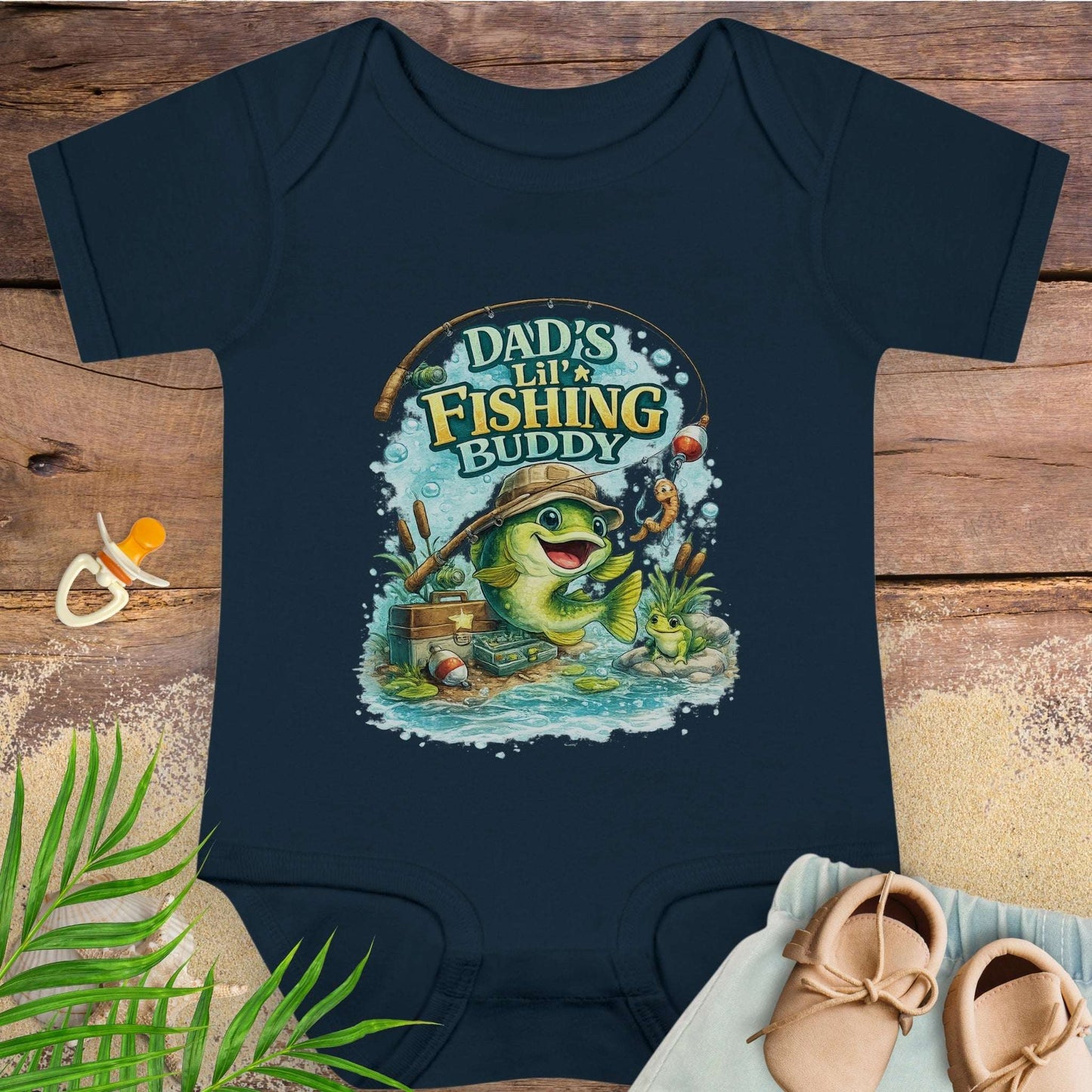 Navy blue baby onesie with 'Dad's Lil' Fishing Buddy' design.