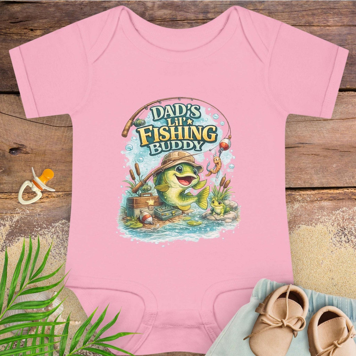 Pink baby onesie with 'Dad's Lil' Fishing Buddy' design.