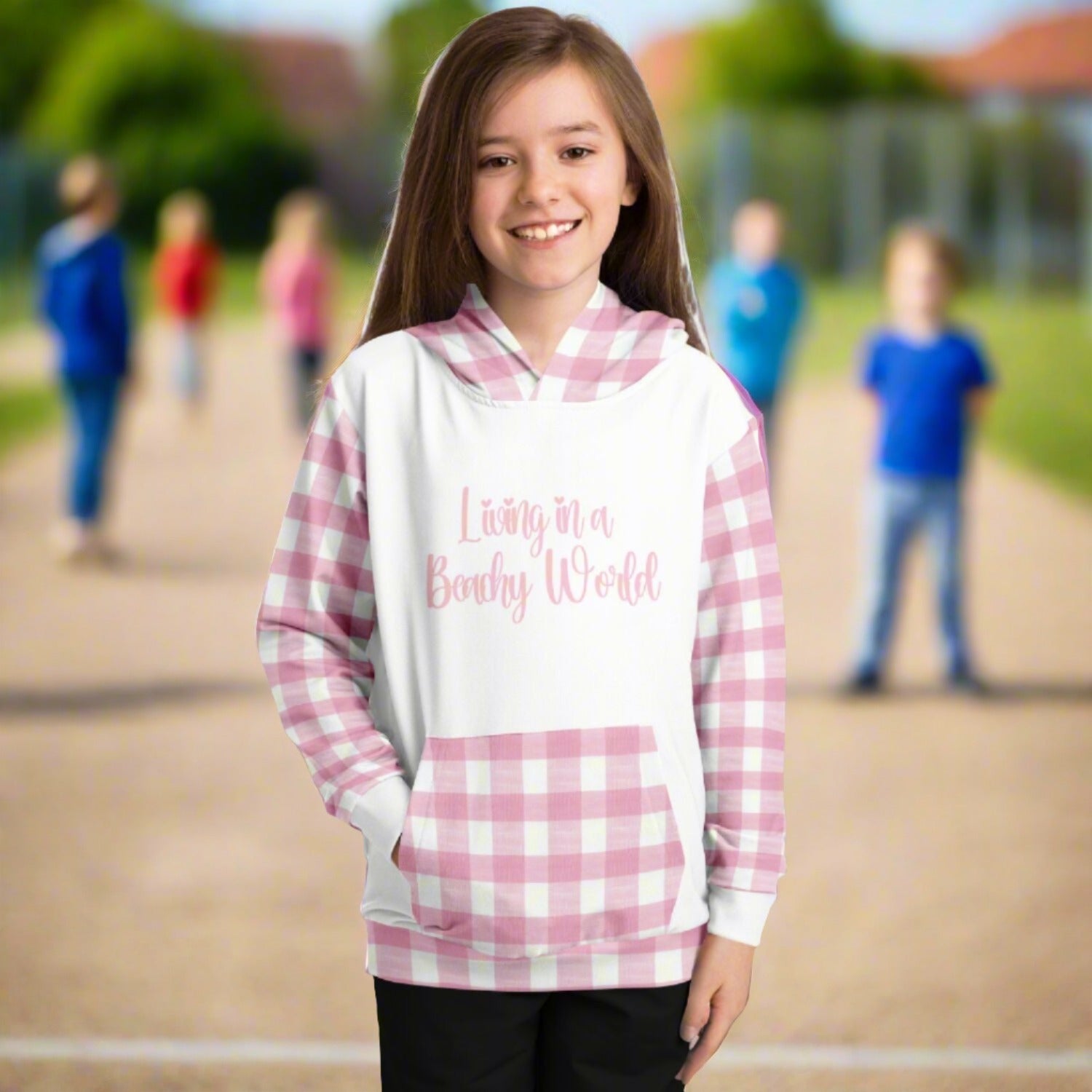 Custom girl's hoodie with white front and back and pink and white gingham sleeves, kangaroo pouch and hoodie that says Living in a Beachy World in fancy font