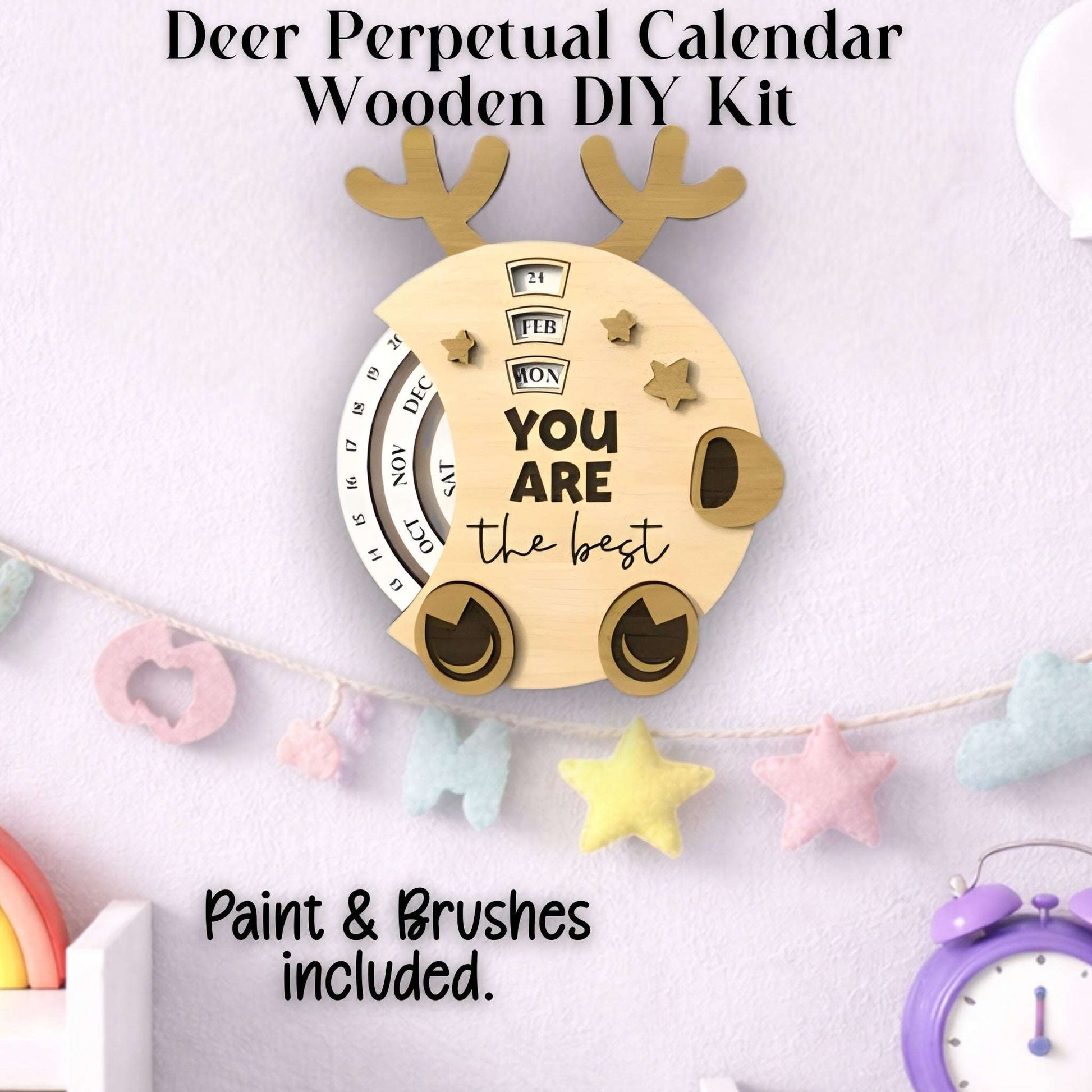 Wooden DIY kit for a perpetual deer calendar with paint and brushes shown completed.