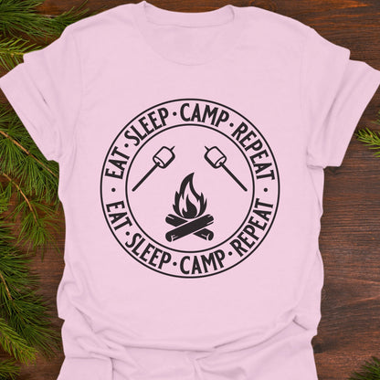 Pink t-shirt with 'Eat Sleep Camp Repeat' graphic.