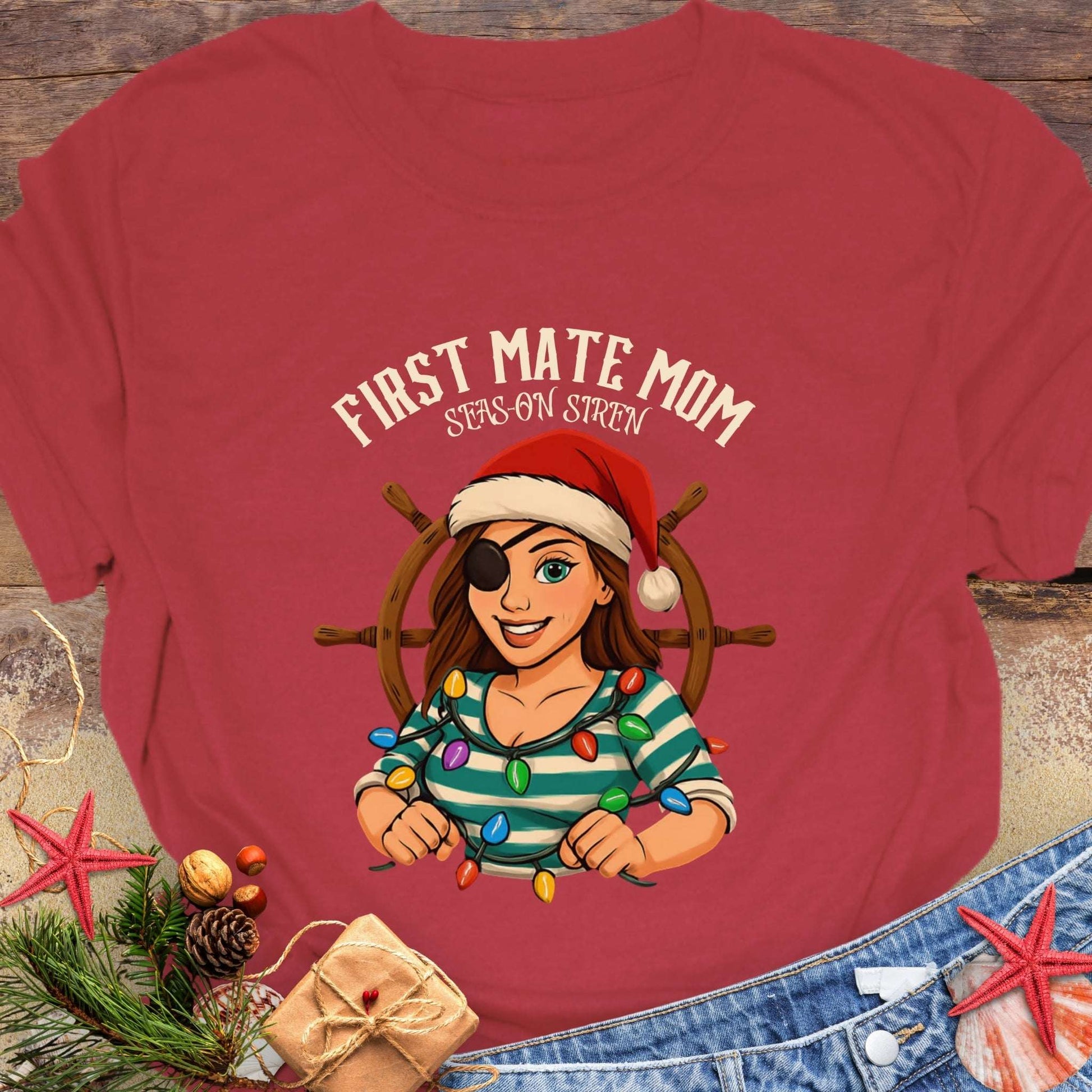 Red t-shirt with a cartoon pirate woman wearing a Santa hat and 'First Mate Mom' text with Christmas decorations that can be personalized.