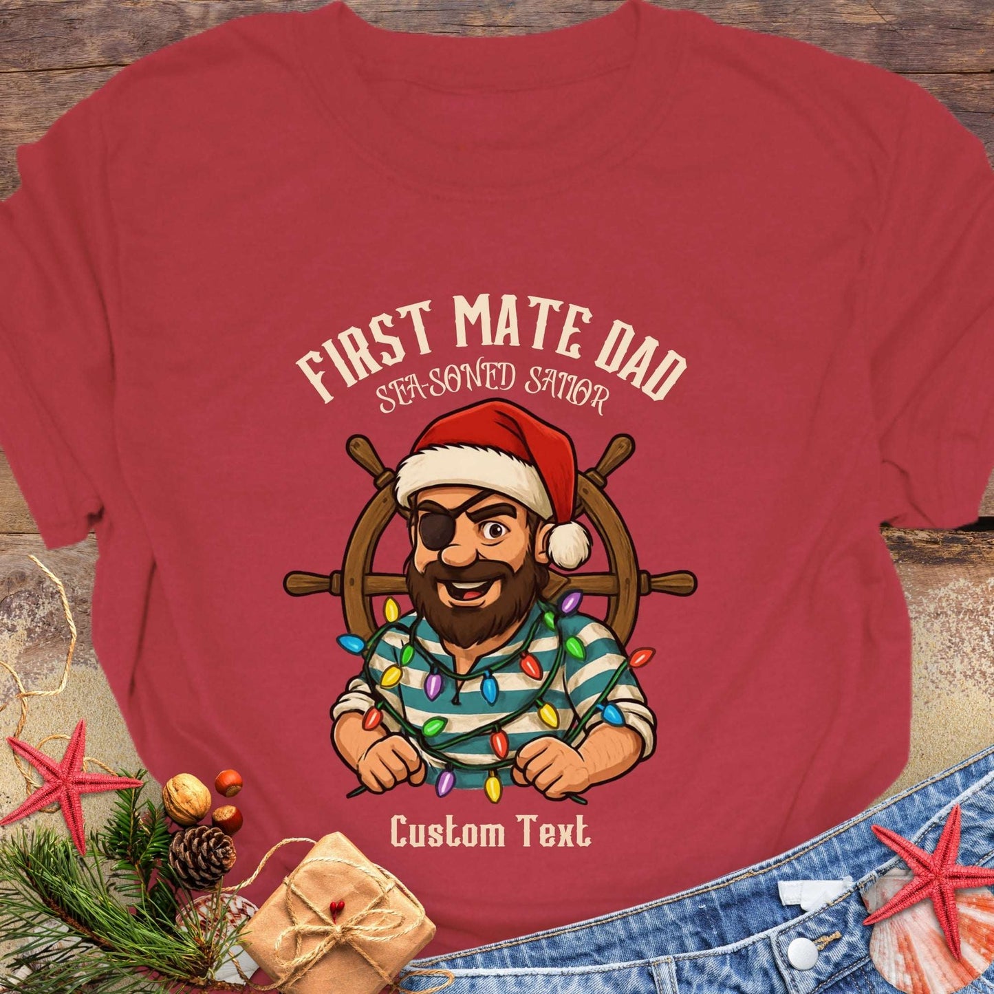 Red t-shirt with a cartoon pirate wearing a Santa hat and  'First Mate Dad' text that can be personalized.