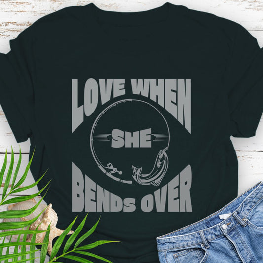Black T-shirt with a fishing pole bending over and the phrase “Love When She Bends Over” – humorous fishing design for anglers