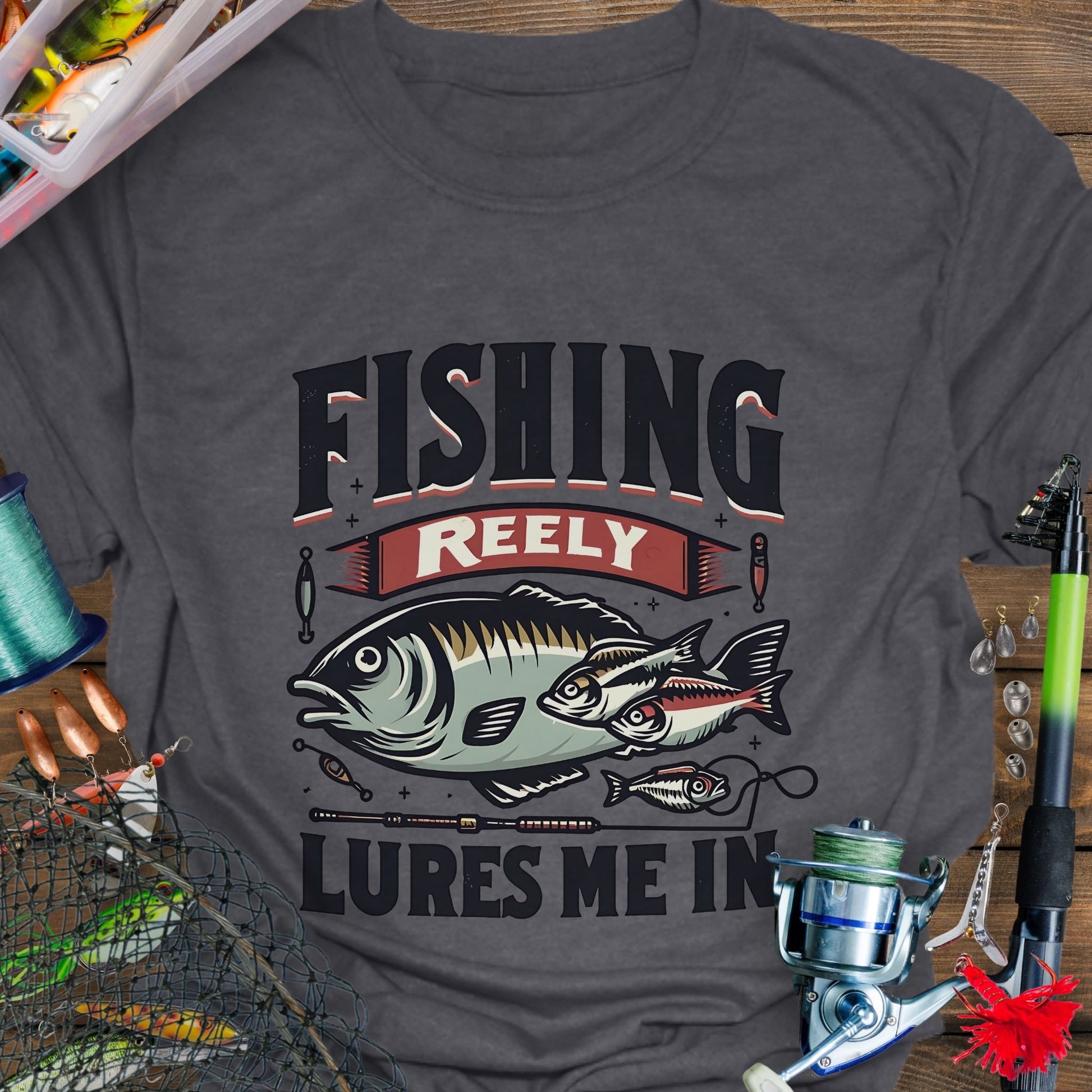 Dark heather Unisex T-shirt featuring the phrase 'Fishing Reely Lures Me In' with a detailed graphic of a fish and fishing lures. Perfect for anglers and fishing enthusiasts, this comfortable tee is great for casual wear, fishing trips, and outdoor adventures.