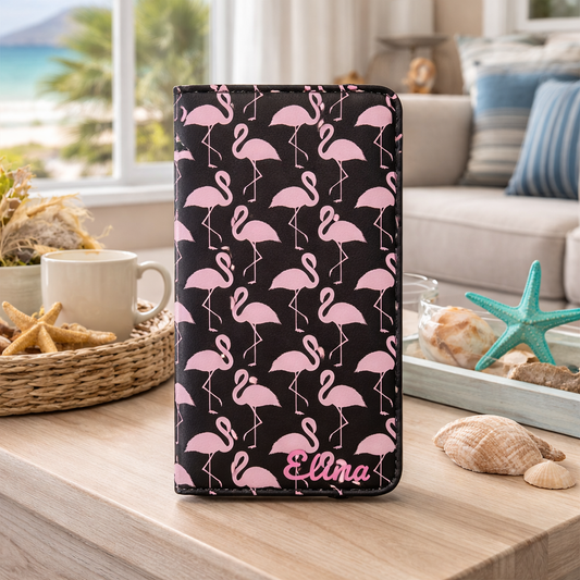 Phone case with pink flamingo pattern on a table in a living room setting