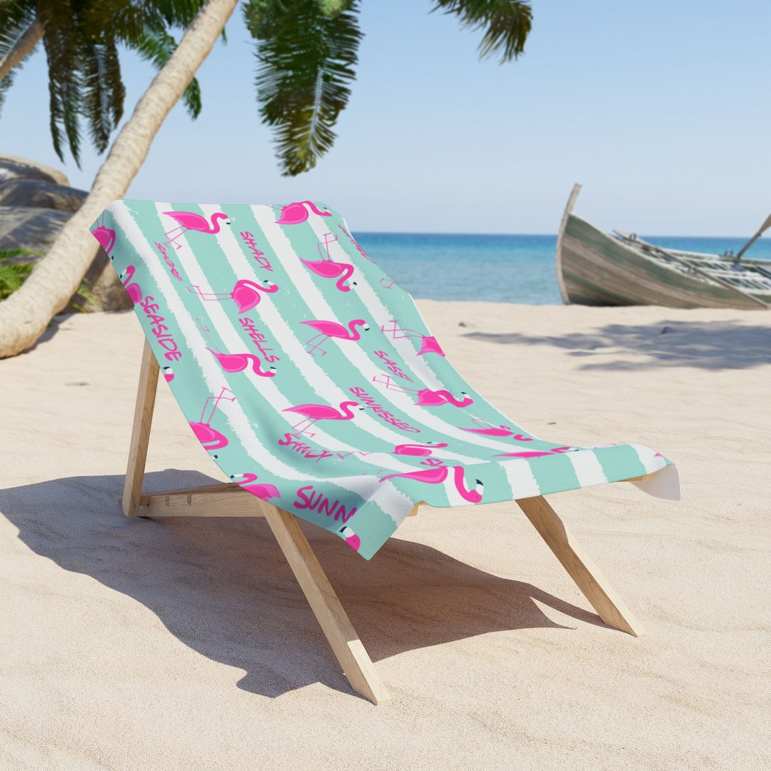 Aqua and white striped beach towel with pink flamingos and playful summer words like Sunshine, Sassy, and Salty.