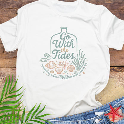 White Go With the Tides t-shirt with ocean bottle design, seashells, and coral artwork.