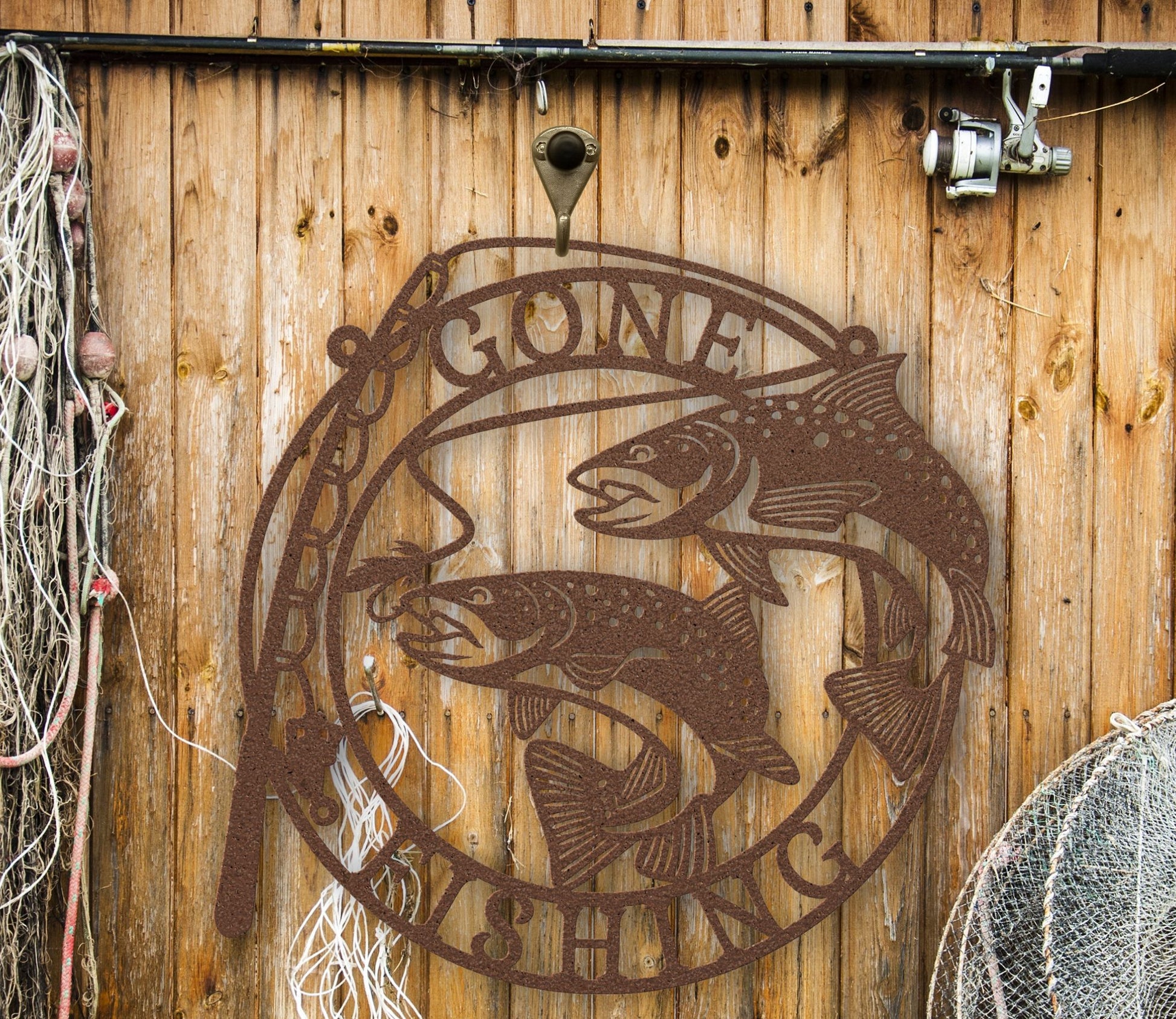 Copper Metal wall art featuring the phrase “Gone Fishing” with a fishing rod and fish silhouette, crafted from steel and available in multiple sizes and finishes.