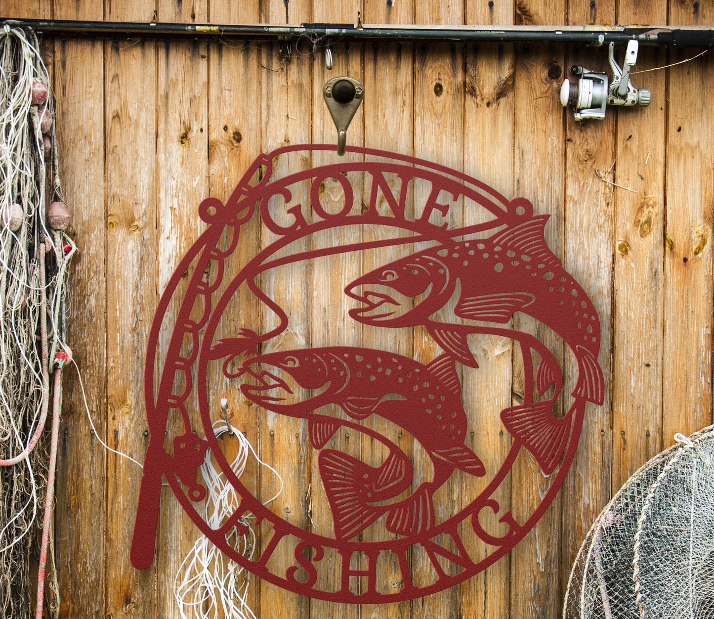 Red Metal wall art featuring the phrase “Gone Fishing” with a fishing rod and fish silhouette, crafted from steel and available in multiple sizes and finishes.