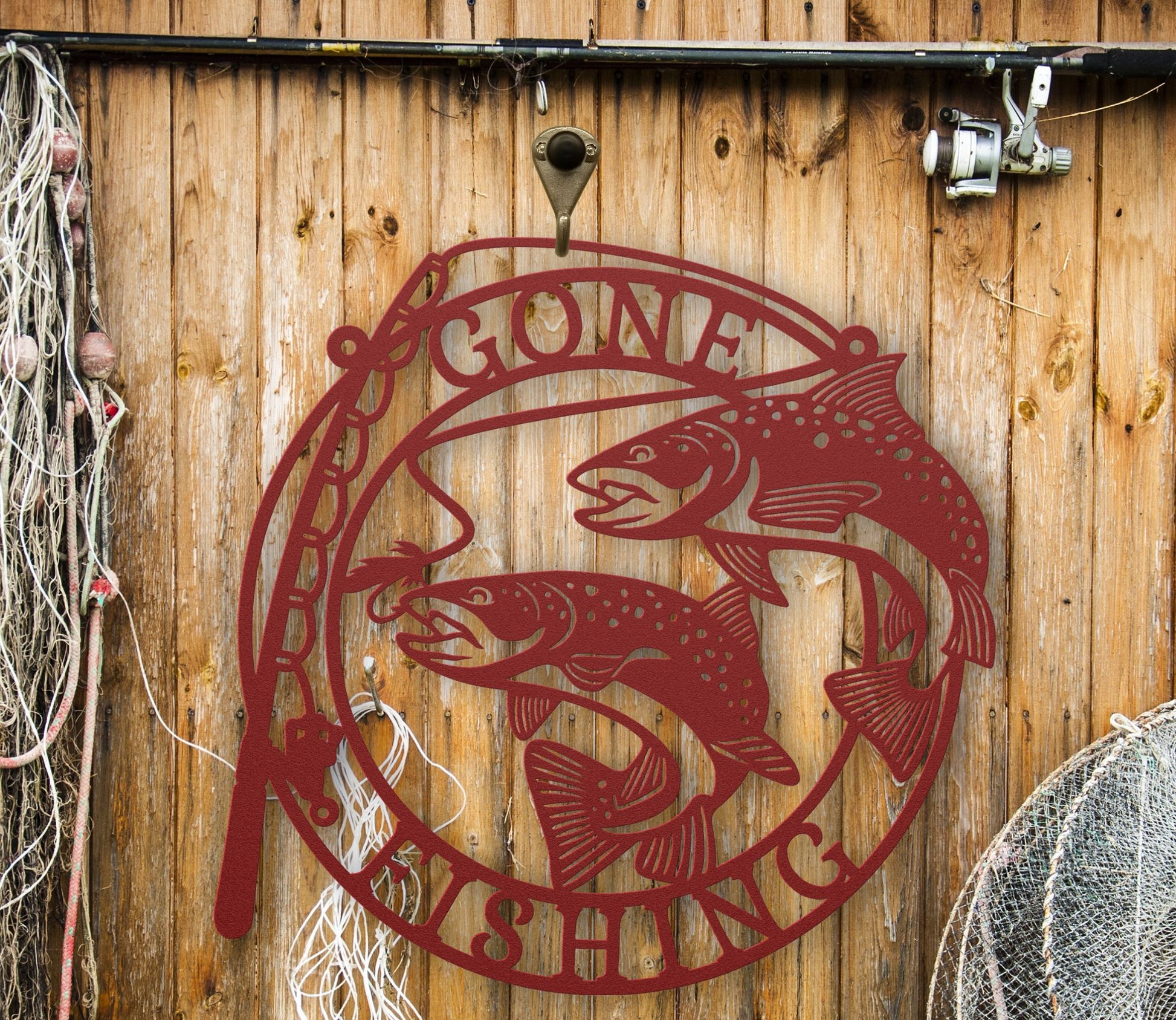 Red Metal wall art featuring the phrase “Gone Fishing” with a fishing rod and fish silhouette, crafted from steel and available in multiple sizes and finishes.