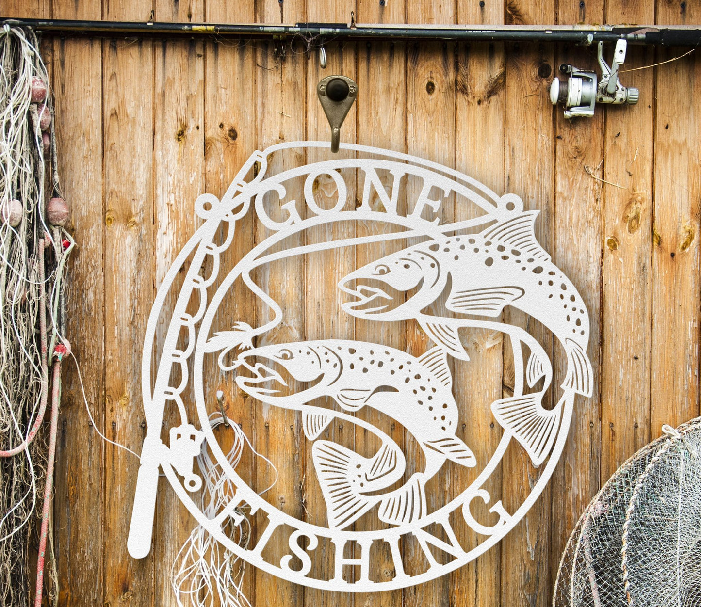 White Metal wall art featuring the phrase “Gone Fishing” with a fishing rod and fish silhouette, crafted from steel and available in multiple sizes and finishes.
