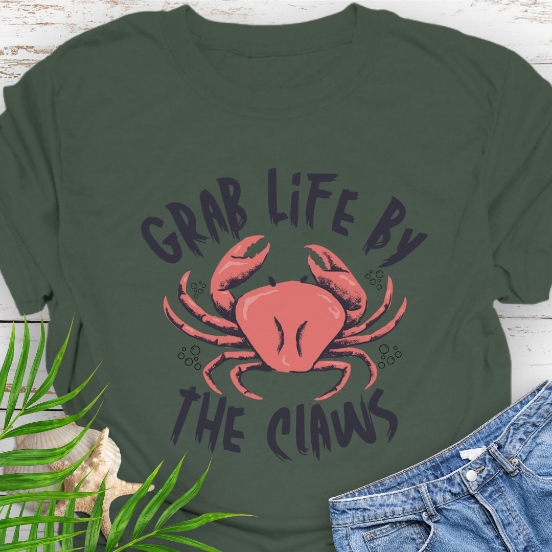 Military Green Unisex t-shirt with 'Grab Life by the Claws' crab graphic on front – coastal-themed summer apparel