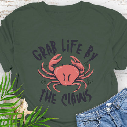 Military Green Unisex t-shirt with 'Grab Life by the Claws' crab graphic on front – coastal-themed summer apparel