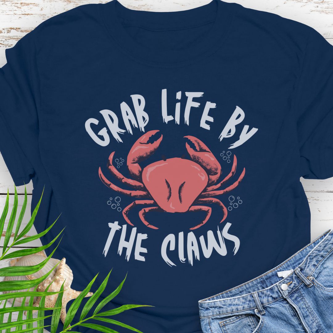 Navy Blue Unisex t-shirt with 'Grab Life by the Claws' crab graphic on front – coastal-themed summer apparel
