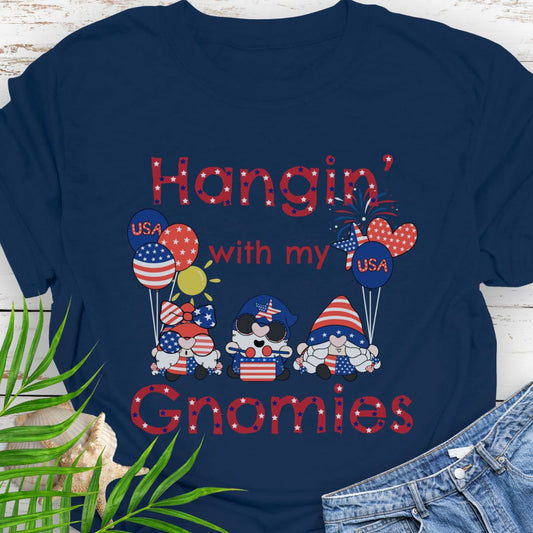 Navy T-shirt with three gnomes in patriotic outfits holding flag balloons with sun and fireworks in the background with the phrase Hangin' with my Gnomies.