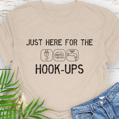Natural  funny camping t-shirt with ‘Here for the Hook-ups’ text and RV utility icons.