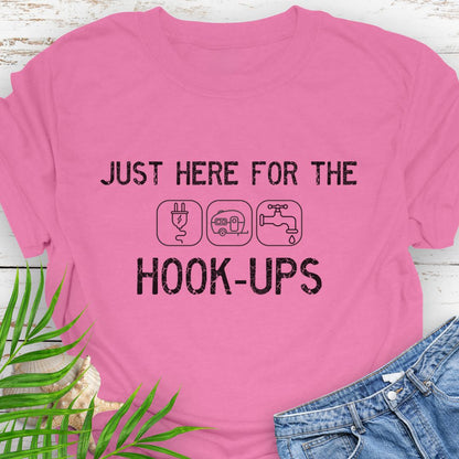 Azalea Pink  funny camping t-shirt with ‘Here for the Hook-ups’ text and RV utility icons.