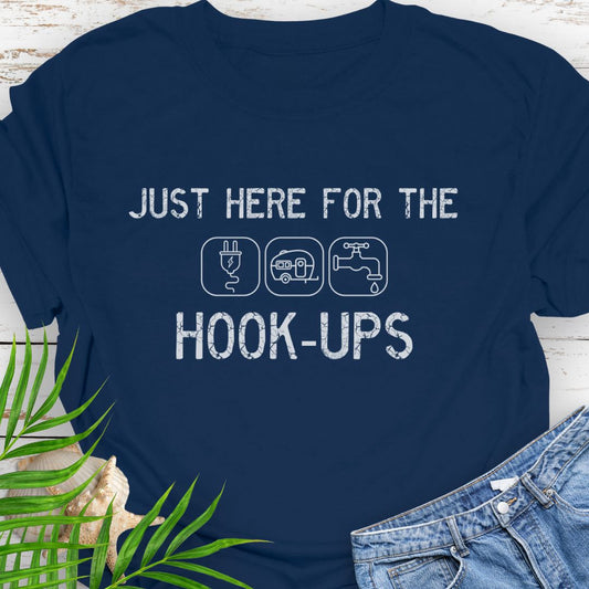 Navy funny camping t-shirt with ‘Here for the Hook-ups’ text and RV utility icons.