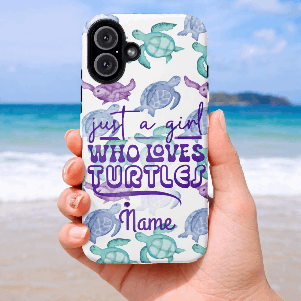 iPhone 17 air phone case with turtle design and text held by a hand on a beach