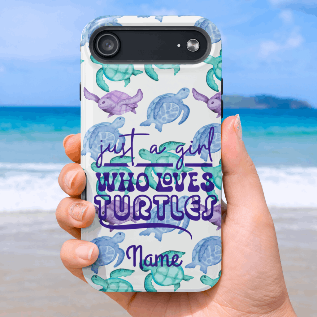 iPhone 17 air Phone case with turtle design and text 'just a girl who loves turtles' held by a hand on a beach.