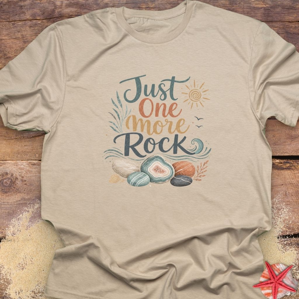 A beige "Just One More Rock" graphic  unisex t-shirt featuring colorful beach stones and agates.