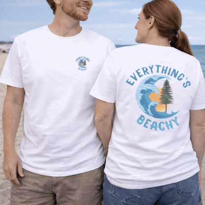 Two people wearing white t-shirts with 'Everything's Beachy' design on a beach.