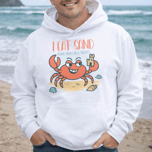 Man wearing a white hoodie with a crab graphic and text I eat sand (sometimes as a treat).