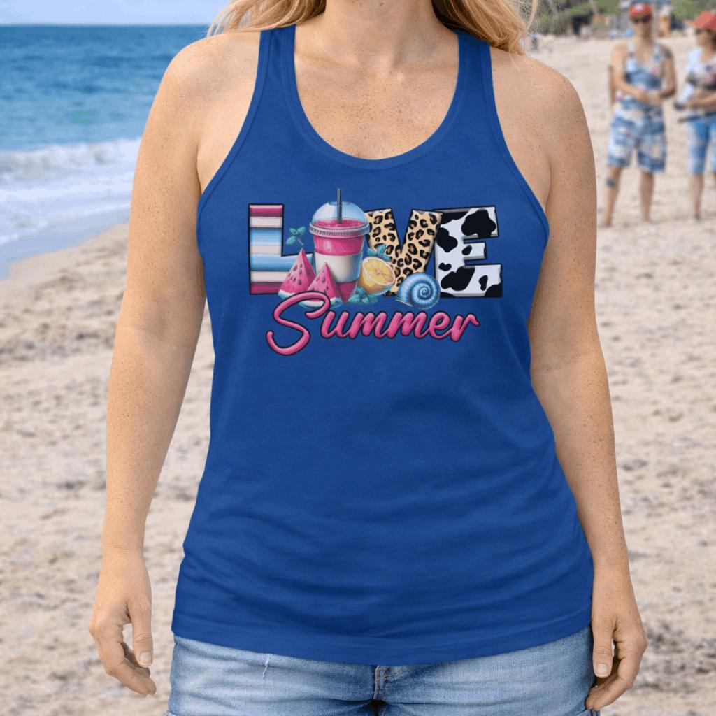 Woman wearing a blue racerback women's tank top with 'Love Summer' design on a beach.