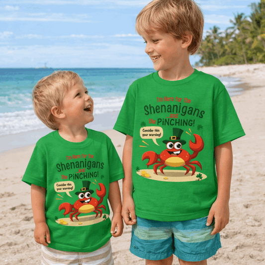 Two children wearing green t-shirts with a crab graphic with text 'I'm Here for the Shenanigans and the Pinching' St. Patrick's Day T-shirt.