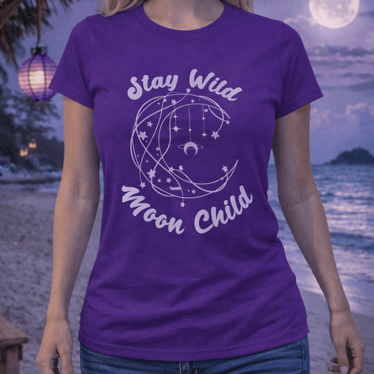 Purple t-shirt with Stay Wild Moon Child with stars and moon graphic.
