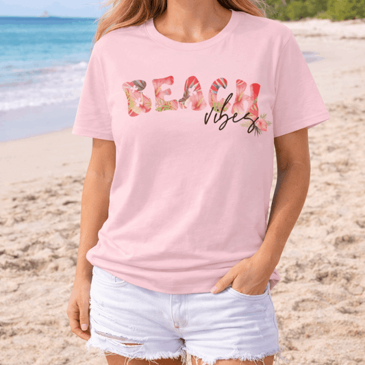 Unisex T-shirt with Beach spelled out in tropical flowers with vibes over.