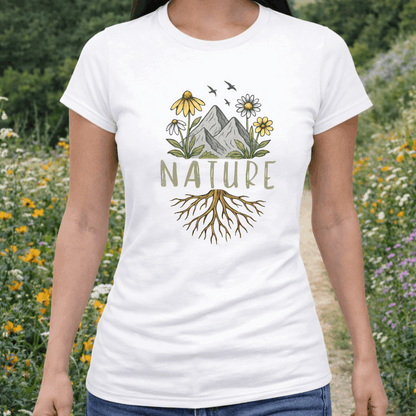 Person wearing a white t-shirt with 'Nature' design in a natural setting