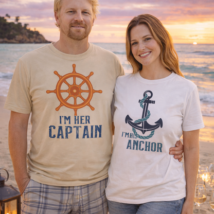 Couple wearing nautical t-shirts. His has a ship wheel with the text 'I'm Her Captain'. The woman's has an anchor and text 'I'm His Anchor'.