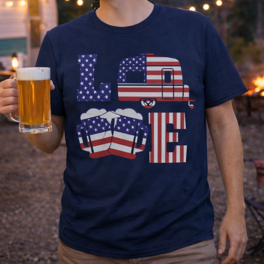 Man wearing a t-shirt with an American camper and beer design, holding a mug of beer outdoors.