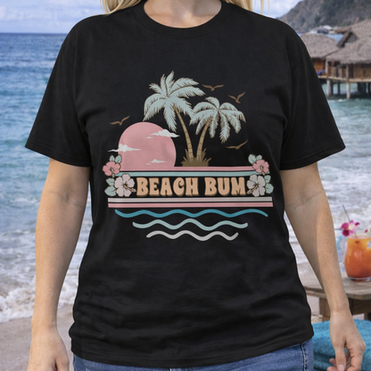 Person wearing a black t-shirt with a 'Beach Bum' graphic on a beach.