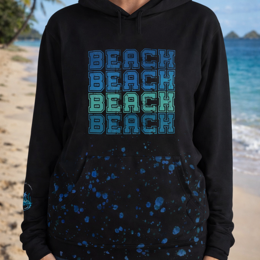 Person wearing a black hoodie with 'BEACH' text and water bubbles across the bottom with a beach vibes image and text on the right sleeve.