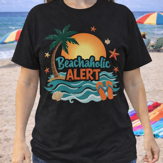 Person wearing a black t-shirt with a beach-themed design that says Beachaholic Alert.