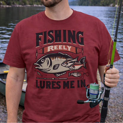 Man wearing a red t-shirt with a fishing graphic and text Fishing Reely Lures Me In.